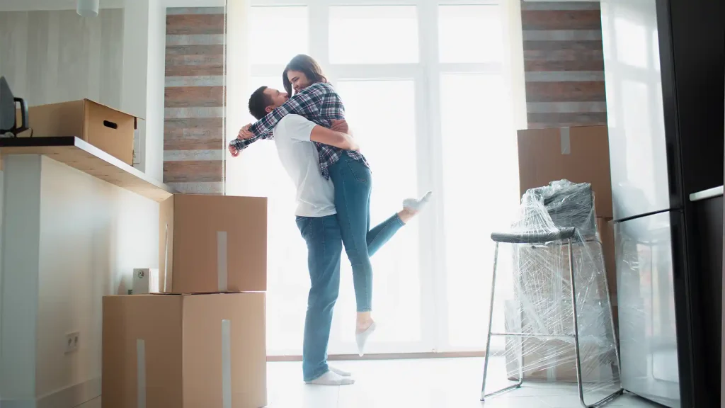 Happy Couple Moving Into A New Home